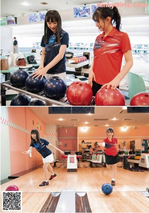 A young woman holding a red bowling ball in a bowling alley.