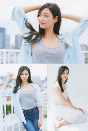 A woman in an orange dress posing for a magazine.