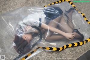 A woman in black stockings and stockings is laying on the ground.