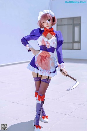 A woman dressed as a maid holding a knife.