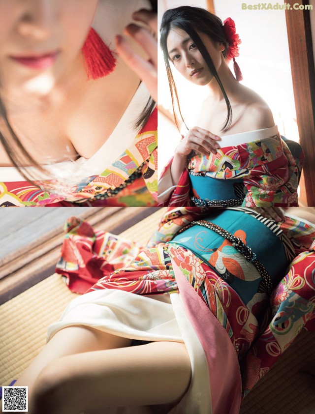 A woman in a colorful kimono sitting on a bed.